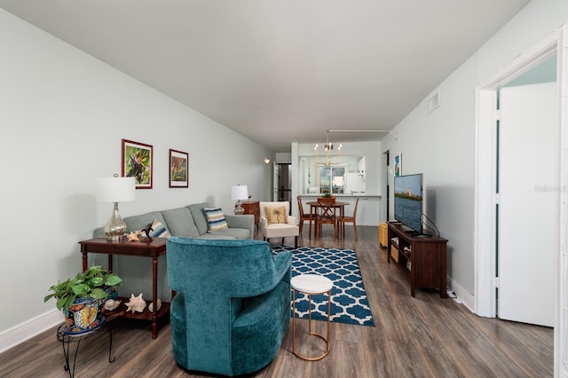 living room featuring dark wood-type flooring