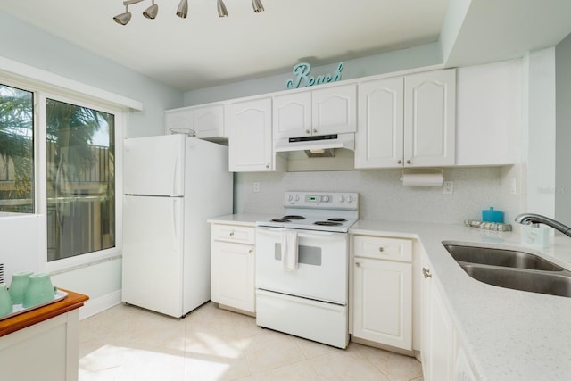 kitchen with white cabinetry, sink, white appliances, and light tile patterned floors