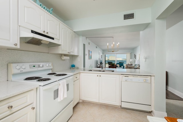 kitchen featuring sink, an inviting chandelier, light tile patterned floors, white appliances, and white cabinets