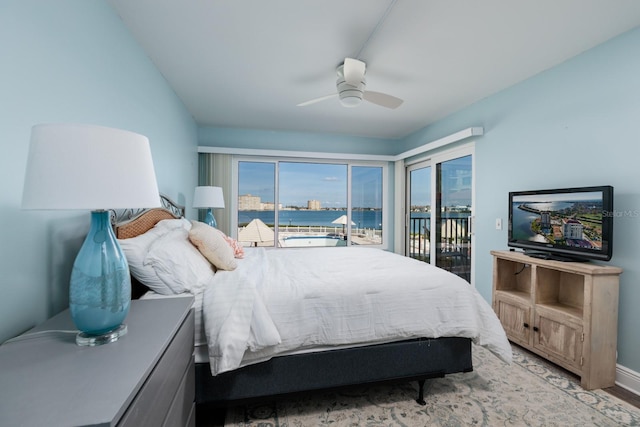 bedroom featuring access to outside, ceiling fan, and light hardwood / wood-style flooring