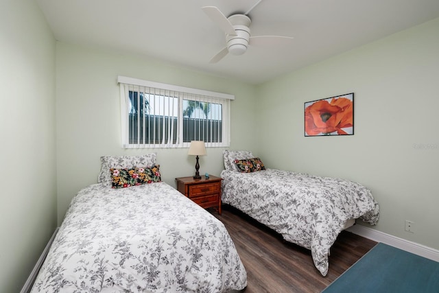 bedroom with dark wood-type flooring and ceiling fan