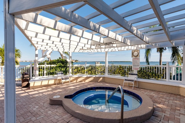 view of pool featuring a water view, a hot tub, a pergola, and a patio