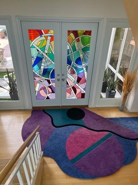 doorway to outside with hardwood / wood-style flooring and french doors