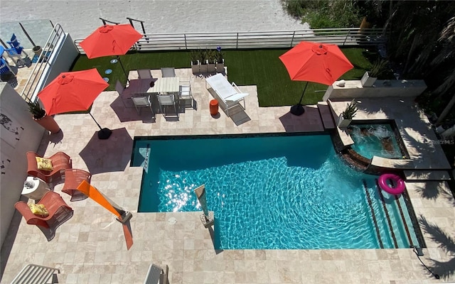 view of pool with an in ground hot tub and a patio