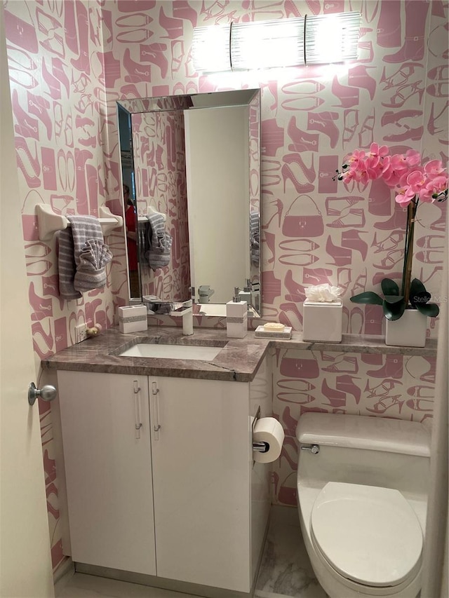 bathroom with vanity and toilet