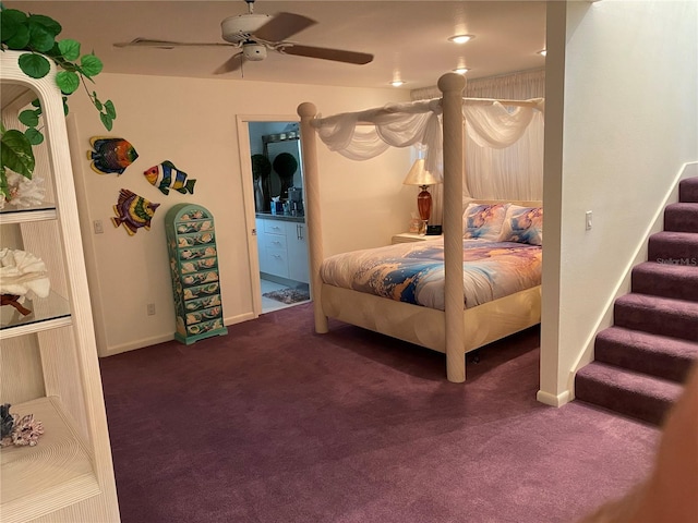 carpeted bedroom with ensuite bath and ceiling fan