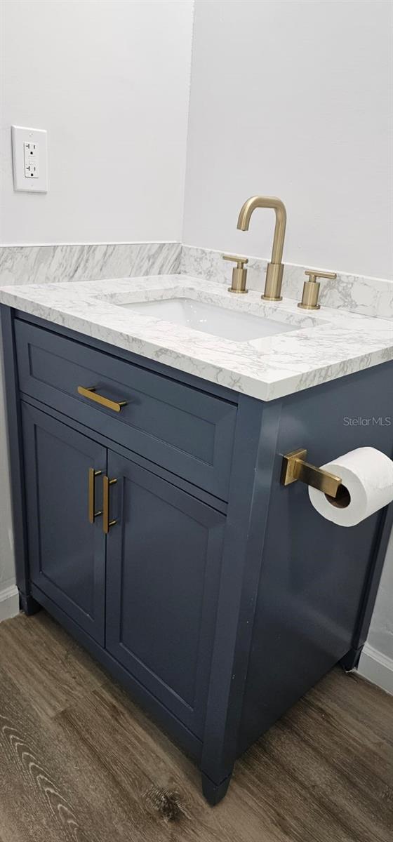 bathroom featuring vanity and wood-type flooring