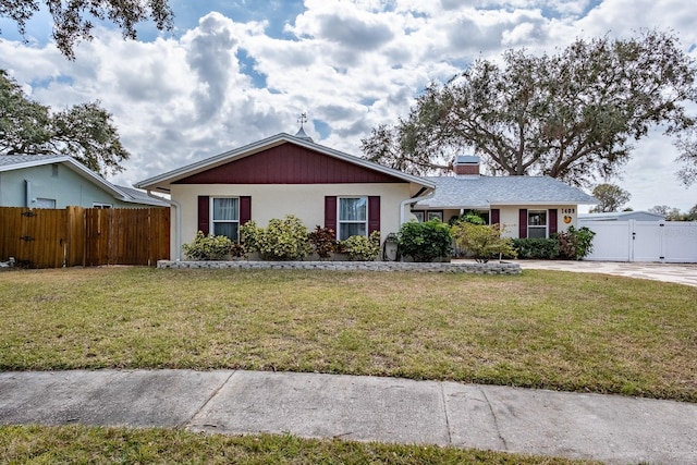 ranch-style house with a front lawn