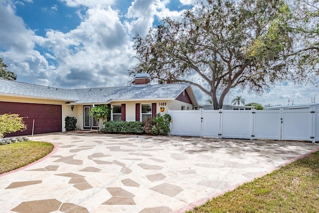 view of front of property with a garage