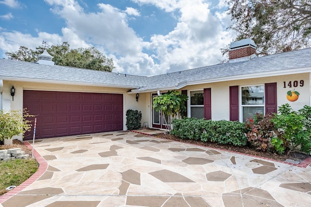 single story home featuring a garage