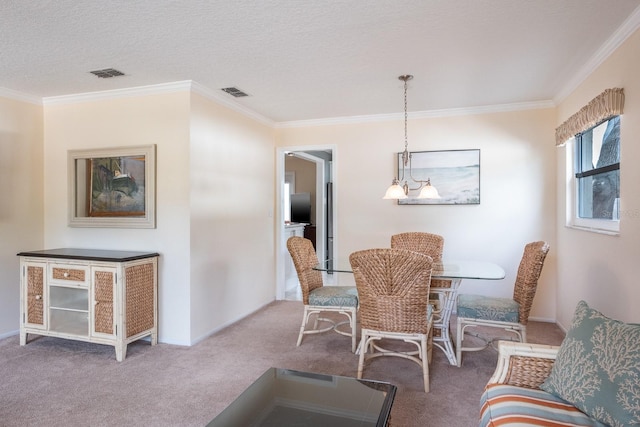 carpeted dining area featuring ornamental molding and a textured ceiling