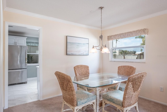 carpeted dining room with ornamental molding