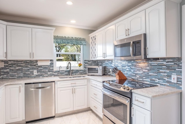 kitchen with white cabinetry, sink, and appliances with stainless steel finishes