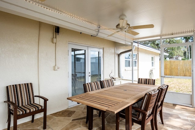 sunroom with ceiling fan and french doors