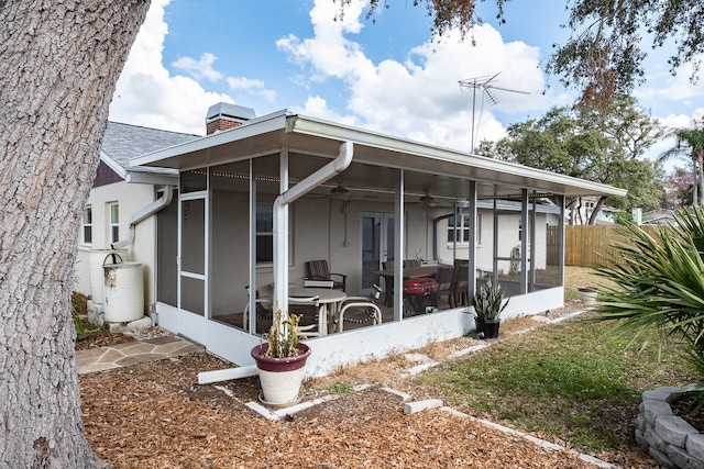 view of front facade with a sunroom