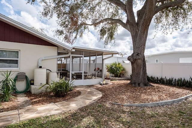 view of yard featuring a sunroom