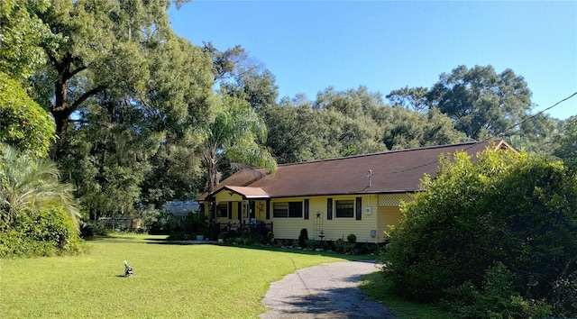 ranch-style house with a front lawn