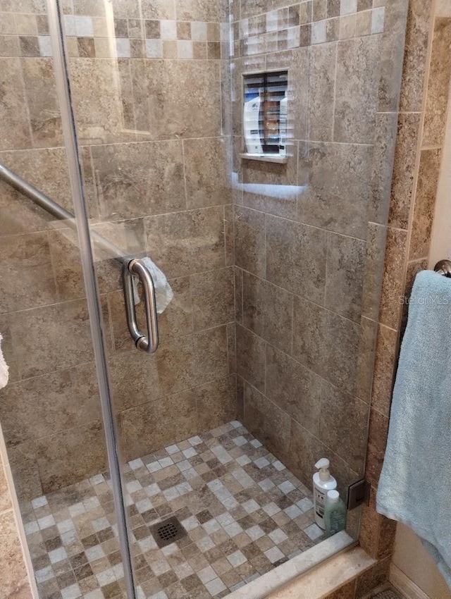 bathroom with an enclosed shower