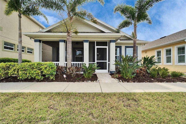 view of front of home with a front yard and stucco siding