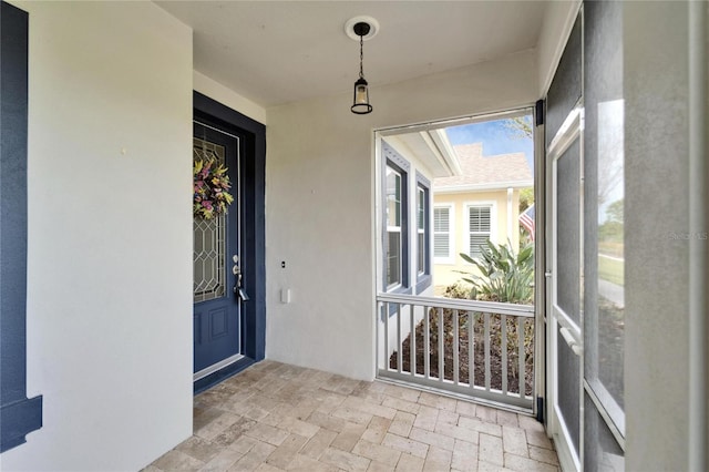 entrance to property with stucco siding