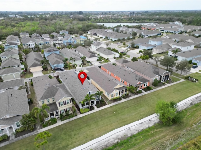 birds eye view of property with a residential view