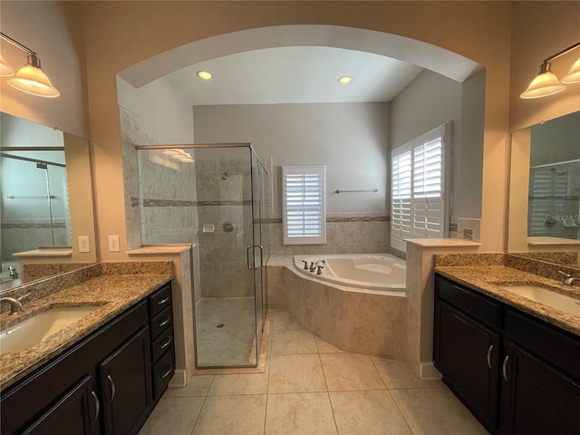 bathroom with vanity, shower with separate bathtub, and tile patterned flooring