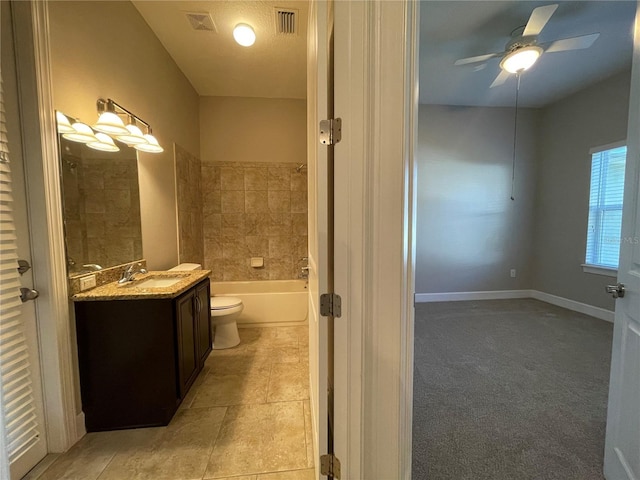 bathroom featuring ceiling fan, vanity, and toilet