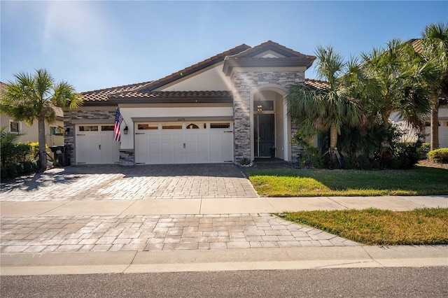 mediterranean / spanish-style home featuring a garage