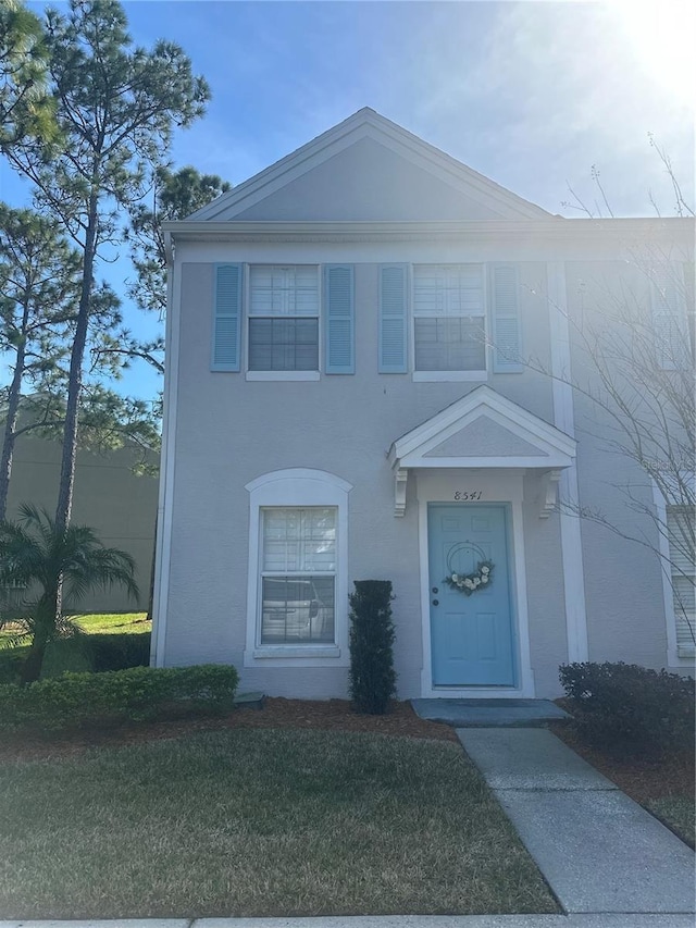 view of front of property with a front lawn