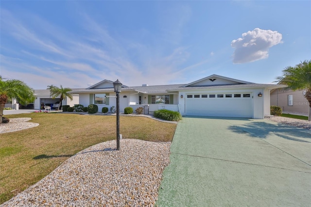 ranch-style house featuring a garage and a front yard