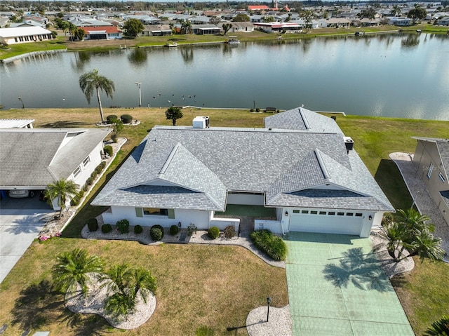 drone / aerial view with a water view