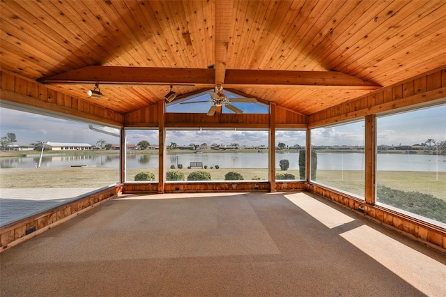 unfurnished sunroom featuring a water view, wood ceiling, and vaulted ceiling with beams