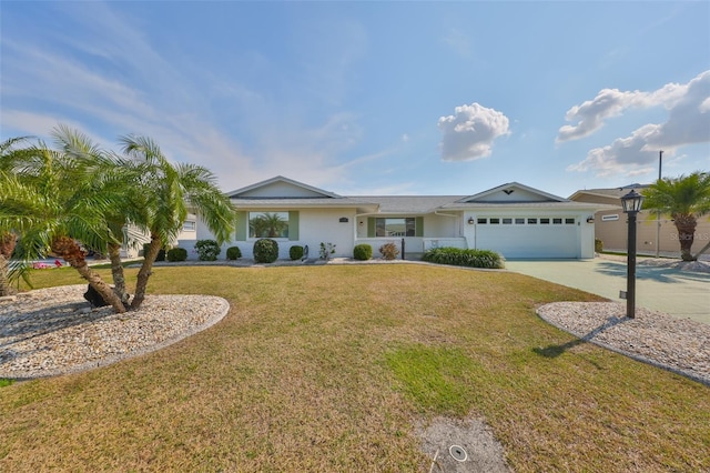 ranch-style house with a garage and a front lawn