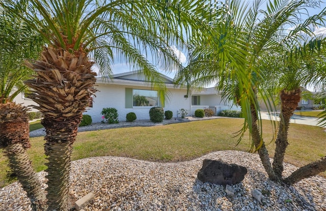 view of side of home featuring a yard