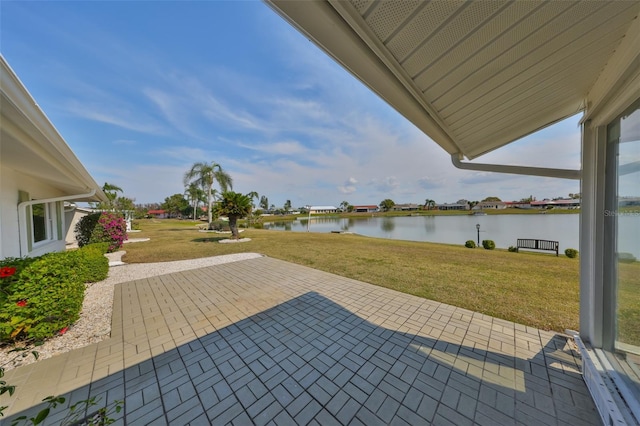 view of patio with a water view