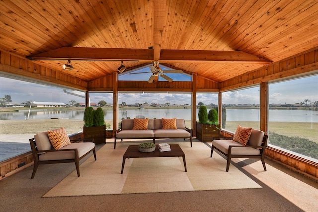 sunroom featuring vaulted ceiling with beams, wood ceiling, ceiling fan, and a water view