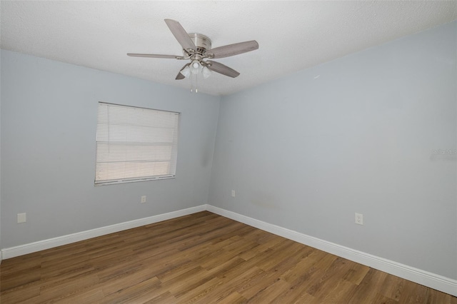 unfurnished room with hardwood / wood-style flooring, a textured ceiling, and ceiling fan