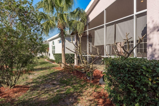 view of side of property with stucco siding