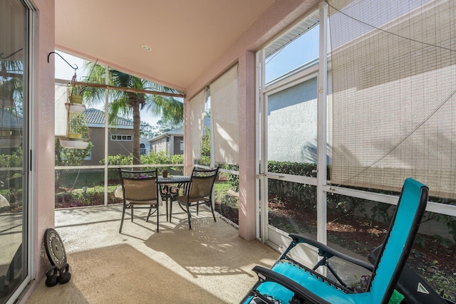 sunroom with vaulted ceiling