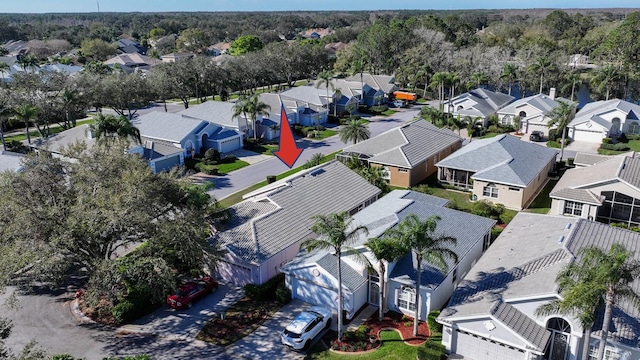 birds eye view of property with a residential view