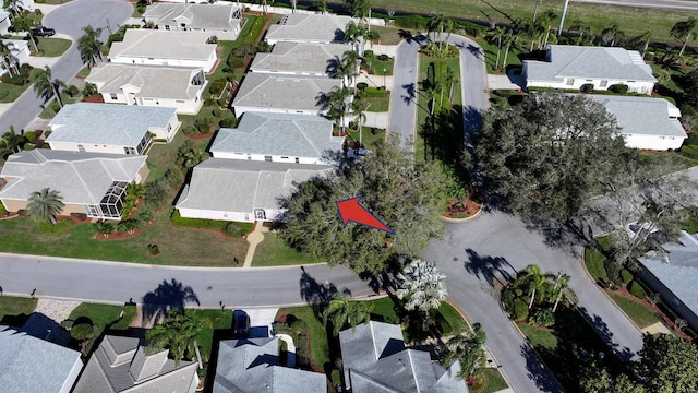 birds eye view of property with a residential view