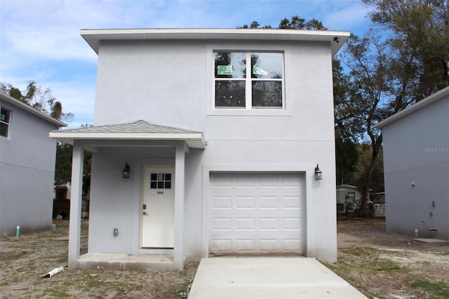 view of front of property with a garage