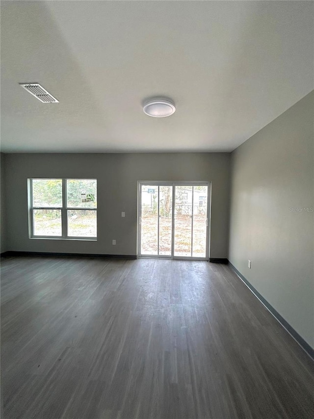 empty room featuring dark hardwood / wood-style floors