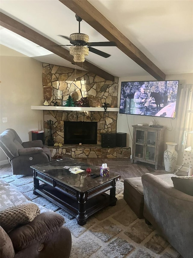 living room with hardwood / wood-style flooring, ceiling fan, a fireplace, and vaulted ceiling with beams