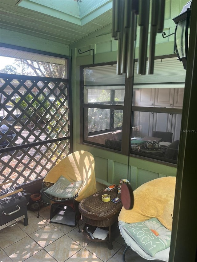 sunroom featuring lofted ceiling