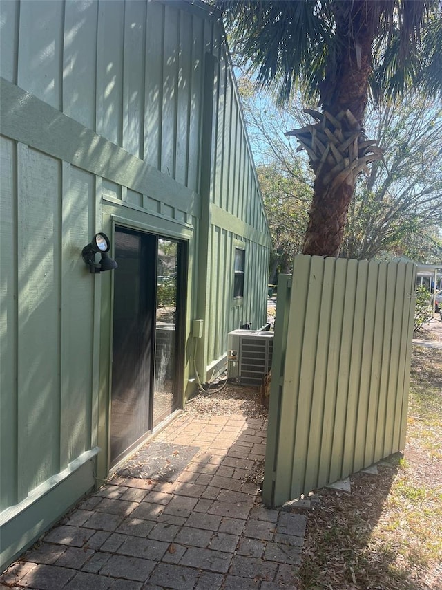 view of side of home featuring cooling unit