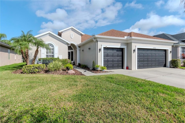 ranch-style home with a garage and a front lawn