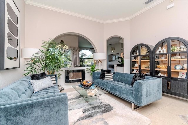 living room featuring ornamental molding and light tile patterned floors