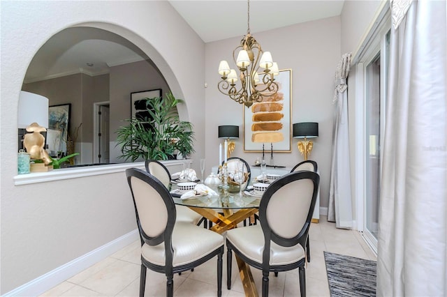 tiled dining area with a chandelier