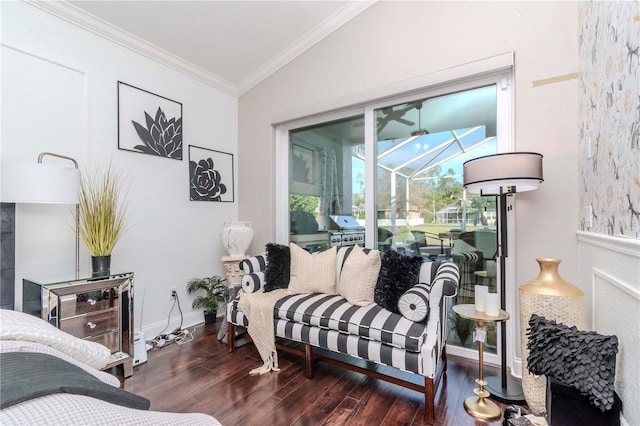 bedroom featuring dark hardwood / wood-style flooring, crown molding, vaulted ceiling, and access to outside